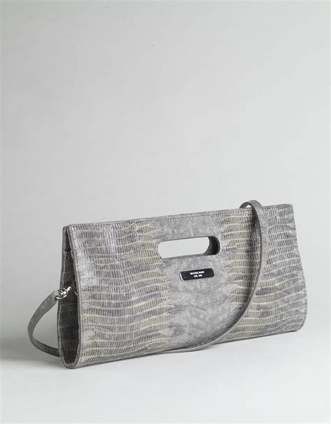 does michael kors use fake snake skin kcutch|michael kors pocket lining.